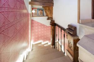 a staircase in a house with pink walls at Apartamentos - PinkSparrow - in Granada +73 photos