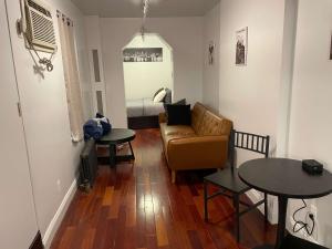 a living room with a couch and a table at Private Studio Apartment in Union Square in New York