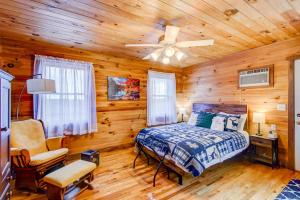 a bedroom with a bed and a ceiling fan at Misty Mornings Escape in Boone