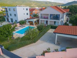 an aerial view of a house with a swimming pool at Villa Kalura in Klanac