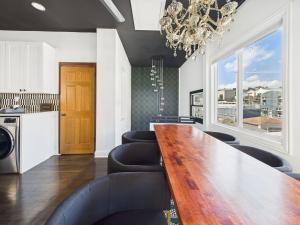 a dining room with a long table and chairs at Playoff Stay Wrigley 4br Garage Firepit Patio in Chicago