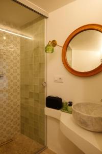 a bathroom with a sink and a mirror at Ca La Portella in Jávea +10 photos