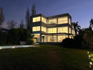 a large black building with many windows at night at Ríohaus in Pueblo Esther