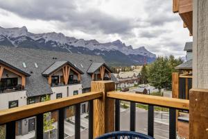 a view from a balcony with mountains in the background at Golden Escape 2 Bdrm Mountain VIEWS - managed by Little Sister Getaways in Canmore