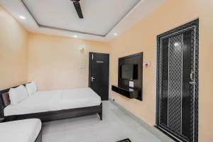 Ένα ή περισσότερα κρεβάτια σε δωμάτιο στο Hotel O The Orchid