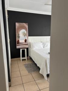 Ένα ή περισσότερα κρεβάτια σε δωμάτιο στο Atterbury Value Bed and Breakfast