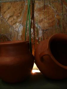 two pottery vases sitting next to each other at Gregorio I Hotel Boutique in San Salvador de Jujuy