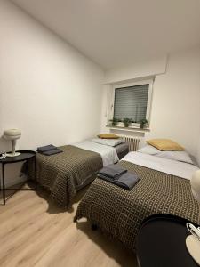 Ένα ή περισσότερα κρεβάτια σε δωμάτιο στο H&H Apartments Ratingen +14 φωτογραφίες