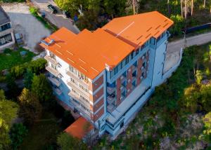 an overhead view of a building with an orange roof at Emerald Borjomi Hotel in Borjomi