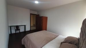 Ένα ή περισσότερα κρεβάτια σε δωμάτιο στο Departamento