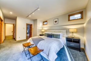 a bedroom with a large bed and two chairs at Aspenwood Ski Getaway in Ketchum +17 photos