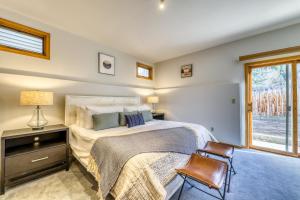 a bedroom with a bed and a chair and a window at Aspenwood Ski Getaway in Ketchum