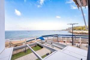 a view of the ocean from a building at Loft Atlántico Patalavaca in Patalavaca