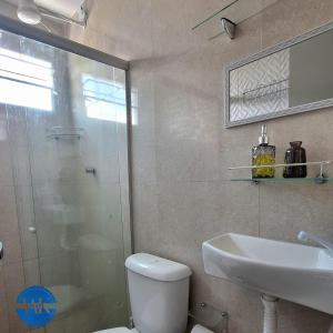 a bathroom with a toilet and a sink and a shower at WK Flat em Porto de Galinhas in Porto De Galinhas