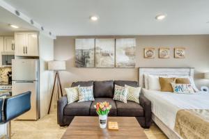 a living room with a bed and a couch at Maui Kai 707 in Kaanapali Airport