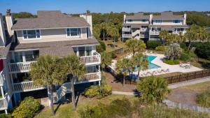 an aerial view of a house with a pool and palm trees at SG10C: 10C Seagrove Villa in Isle of Palms