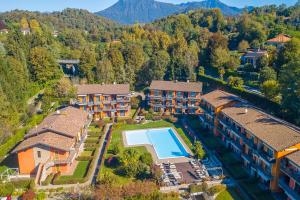 an aerial view of a resort property with a swimming pool at Lenni Apart Swimming Pool and lake - Happy Rentals in Leggiuno