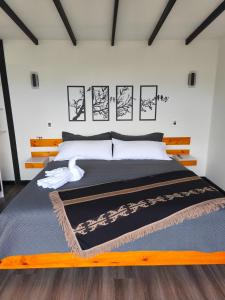 Ένα ή περισσότερα κρεβάτια σε δωμάτιο στο Cerro Kristal