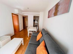a living room with a couch and a table at PREDICADORES ll in Zaragoza
