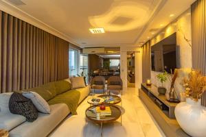 a living room with a couch and a table at Edifício Antônio Landi in Curro Velho