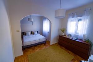 Ένα ή περισσότερα κρεβάτια σε δωμάτιο στο Casa da Boavista