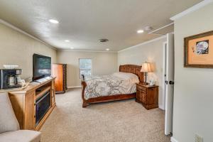 a bedroom with a bed and a tv at Walk to River Oacoma Home with Dog-Friendly Yard! in Oacoma