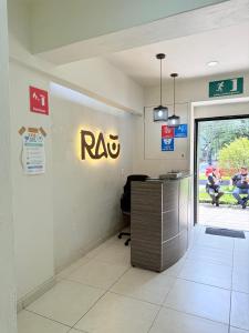 an office with a desk and arax sign on the wall at Rau Departamentos in Guadalajara