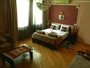 Postel nebo postele na pokoji v ubytování David Hotel - Ethno style