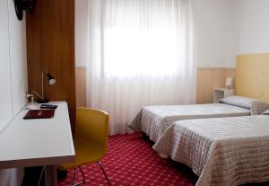 Posteľ alebo postele v izbe v ubytovaní Albergo Ristorante Belvedere