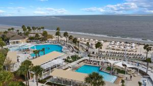 an aerial view of a resort with a pool and the beach at BW3038: 3038 Baywood Drive in Seabrook Island
