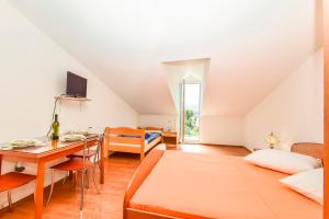 Postel nebo postele na pokoji v ubytování Apartments Zoricic