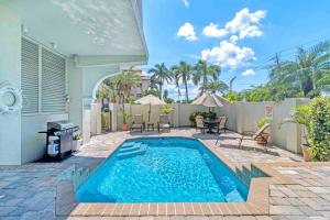 a swimming pool in the backyard of a house at Villa Vista Mare - 675 in Siesta Key