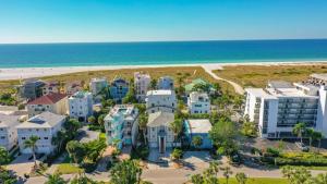 an aerial view of a house and the beach at Island Escape - 638 in Siesta Key