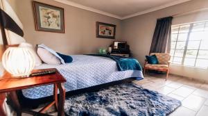Postel nebo postele na pokoji v ubytování Midvaal Guesthouse