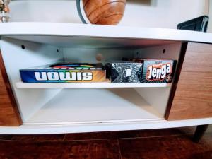 a white shelf with snacks on it at Heart of San Diego-Walk Score 82-Backyard -BBQ-HBO in San Diego +14 photos