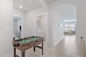 a living room with a foos ball on a table at Hot Tub Haven by Hospitals & Beach in Cape Coral