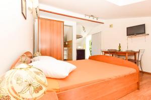Postel nebo postele na pokoji v ubytování Apartments Zoricic