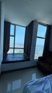 Ένα ή περισσότερα κρεβάτια σε δωμάτιο στο Apartemen Anderson dan Benson Connecting Supermall X1