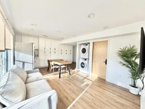 a living room with a couch and a table at 1433 Nespace in Los Angeles