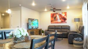a living room with a table and a couch at Red Rock Retreat Your Home Away From Home in Kanab
