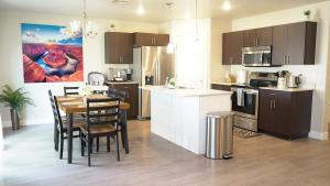 a kitchen and dining room with a table and a dining room at Red Rock Retreat Your Home Away From Home in Kanab
