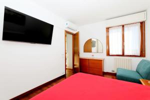 a living room with a flat screen tv on a wall at Luxury Panoramic Apt w Garage Happy Home Bergamo 2 in Bergamo