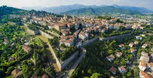 an aerial view of a city with buildings and trees at Luxury Panoramic Apt w Garage Happy Home Bergamo 2 in Bergamo