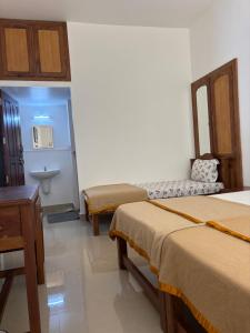 Postel nebo postele na pokoji v ubytování Bon Voyage Signature Holidays + 1 fotografie