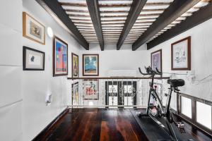 a room with a bike parked in the middle at Old San Juan Art Loft Fast Wifi Near El Morro in San Juan