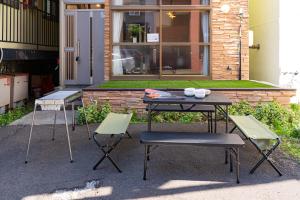 three chairs and a table and a table and chairs at Extreme in Sapporo +55 photos