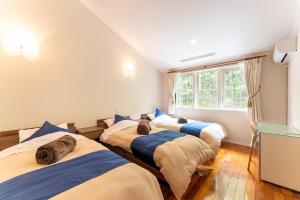 Postel nebo postele na pokoji v ubytování Noёl HAKONE GENSEN + 55 fotografií