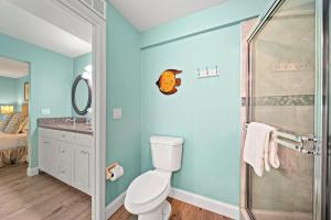 a bathroom with a toilet and a shower at Sand Dollar Suite - 632A in Siesta Key