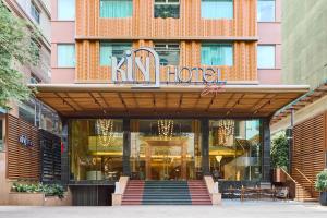 a store front of a building with a sign on it at Kin Hotel Thi Sach in Ho Chi Minh City