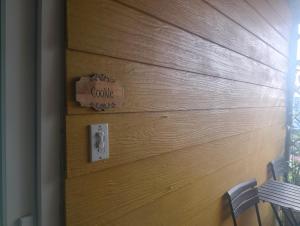 a wooden door with a sign that says curry on it at Đối diện cafe CATINAT villa Kagen in Da Lat +4 photos